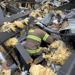 Assistant Chief Chris Travis and Siedel performing search and recovery operations at the candle factory the next morning. Assistant Chief Chris Travis and Siedel performing search and recovery operations at the candle factory the next morning.