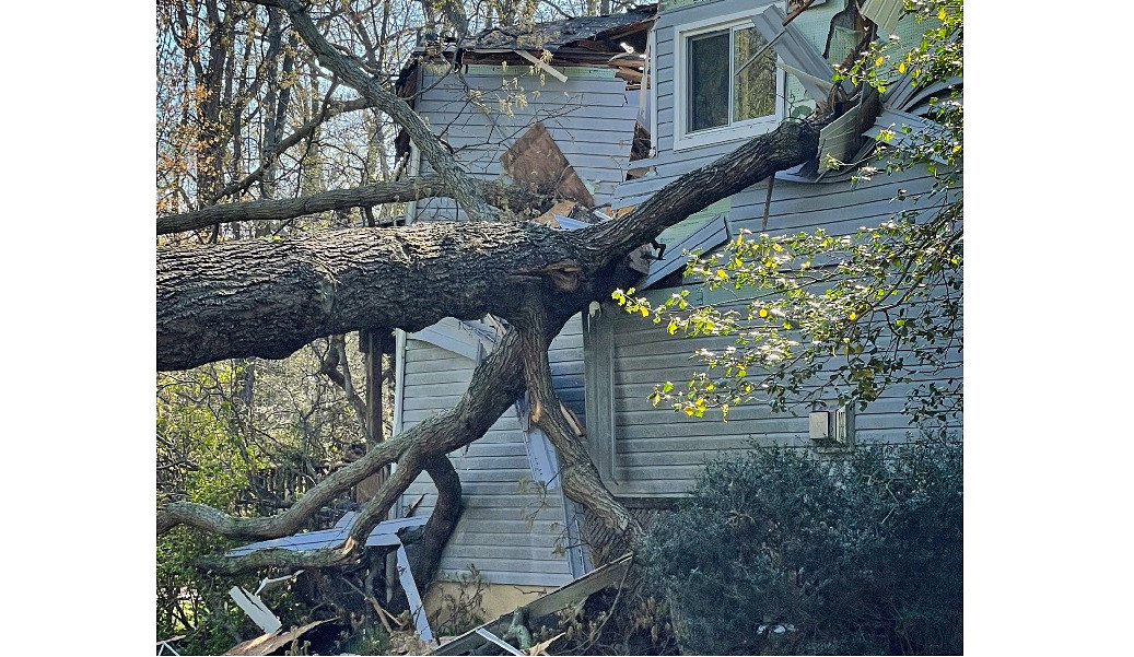 Severe weather caused an oak tree to fall into a home killing one occupant and injuring two others.