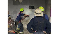 Boston firefighters work to rescue a man who fell and was trapped between two walls at a commuter rail station. Boston firefighters work to rescue a man who fell and was trapped between two walls at a commuter rail station.