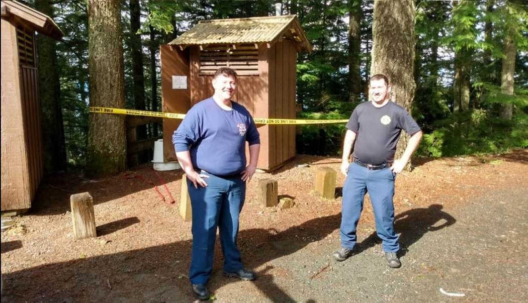 A woman had to be rescued by Brinnon and Quilcene firefighters after falling into a vault toilet while attempting to retrieve her cell phone.