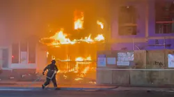 A DC Fire and EMS firefighter was injured battling a vacant building fire that extended to an adjacent property.