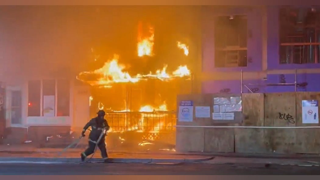 A DC Fire and EMS firefighter was injured battling a vacant building fire that extended to an adjacent property.