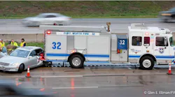 A Fort Worth fire truck sustained rear end damage when a vehicle slid into it on a rain slick highway.