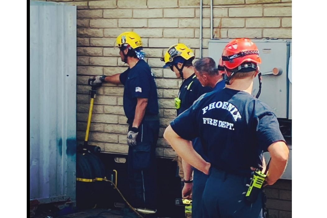 Phoenix and Glendale Firefighters Rescued a Man Trapped Between a Container and a Wall