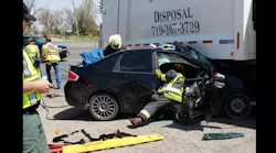 Rocky Ford firefighter had to extricate a man after his sedan became trapped under a refuse truck.