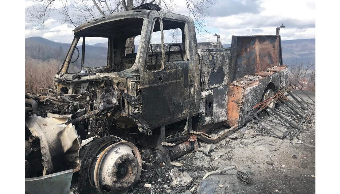 A Sevier County firefighter trapped during a wildland fire used a thermal imaging camera to find his way to safety.