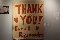 This message was created by community members and hung outside of EMS 32 in Brooklyn. The curator felt it was important to show it as is (faded color and frayed around the edges) to show how long it remained outside.