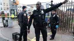 Police and emergency responders gather at the site of a reported shooting of multiple people outside of the 36 St subway station in Brooklyn borough.