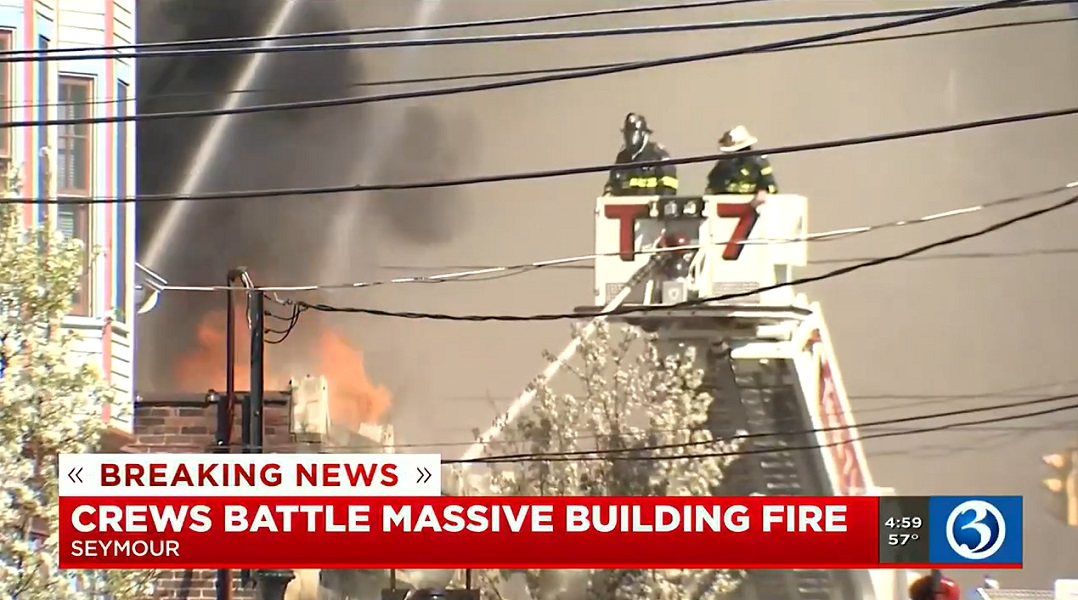 Multiple fire department battled a three-alarm fire that tore through downtown Seymour damaging multiple businesses.