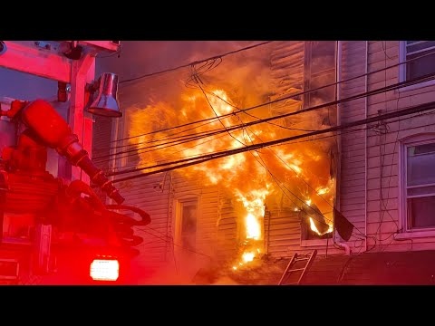 Allentown firefighters battled a three-alarm fire that tore through a rowhome sending a family of six to the hospital.