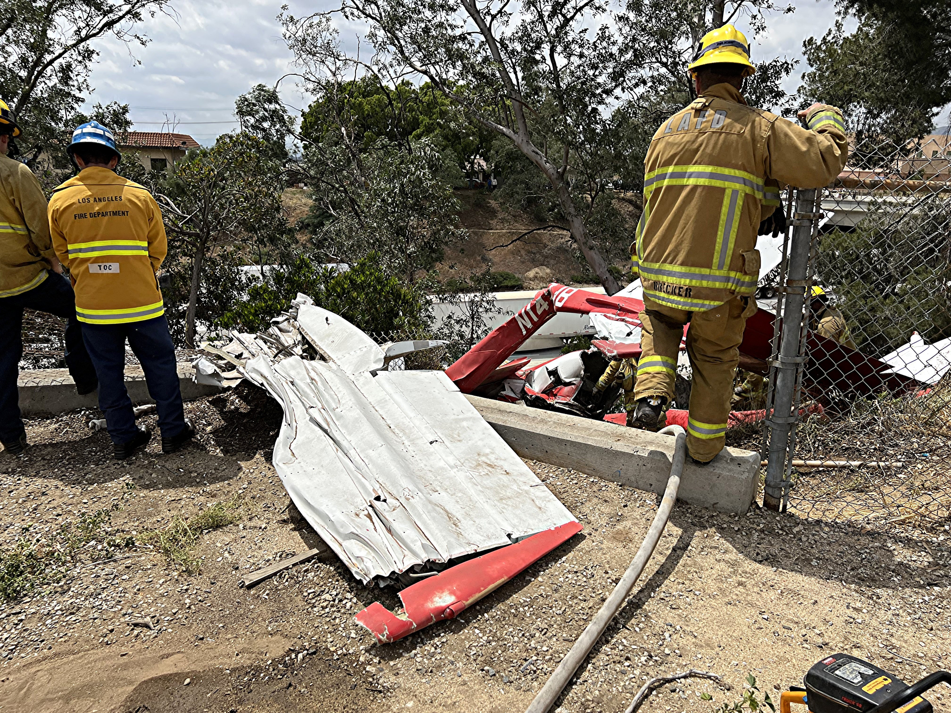 A small plane crash adjacent to the 210 freeway in the Sylmar neighborhood of Los Angeles has claimed one life.