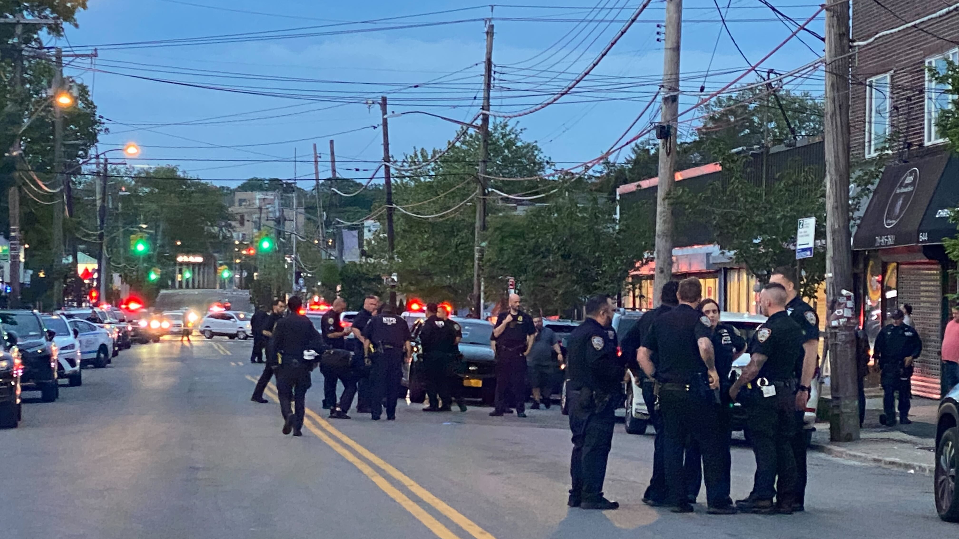 Police at the scene where an EMT was shot in Staten Island on Thursday evening.