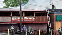 Firefighters were able to stop the fire before it spread through voids to adjacent businesses. Firefighters were able to stop the fire before it spread through voids to adjacent businesses.