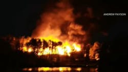 The Beach Cove Waterfront Inn in Boothbay Harbor was seen burning in the distance Monday night. The Beach Cove Waterfront Inn in Boothbay Harbor was seen burning in the distance Monday night.