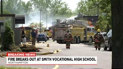 Firefighters cool down hotspots after a fire broke out in 'E' building at Smith Vocational and Agricultural High School in Northampton. Firefighters cool down hotspots after a fire broke out in 'E' building at Smith Vocational and Agricultural High School in Northampton.