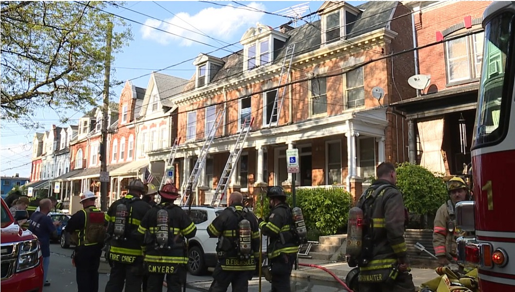 A Lancaster firefighter was injured after falling through a skylight battling a dwelling fire.