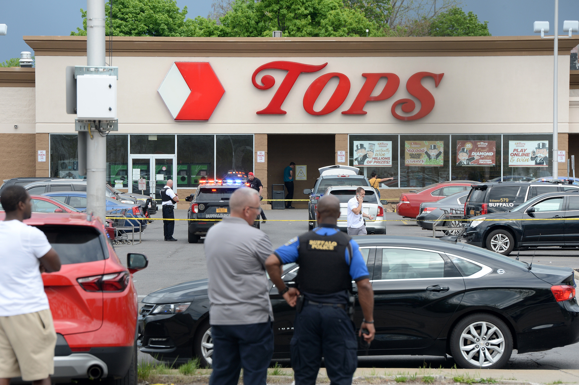 Officials said the 9-1-1 operator allegedly hung up on a Tops supermarket worker who was calling for help.