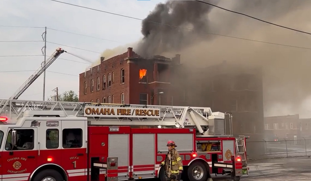 Omaha firefighters battle flames in a vacant apartment building recently closed by city officials.
