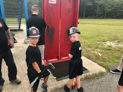 Two recruits prepare to improve their times on the forcible entry door.