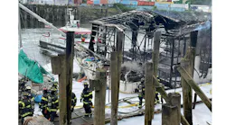 Seattle firefighters recovered the body of a man from one of three boats that were destroyed in fire at a Duwamish Waterway boathouse.