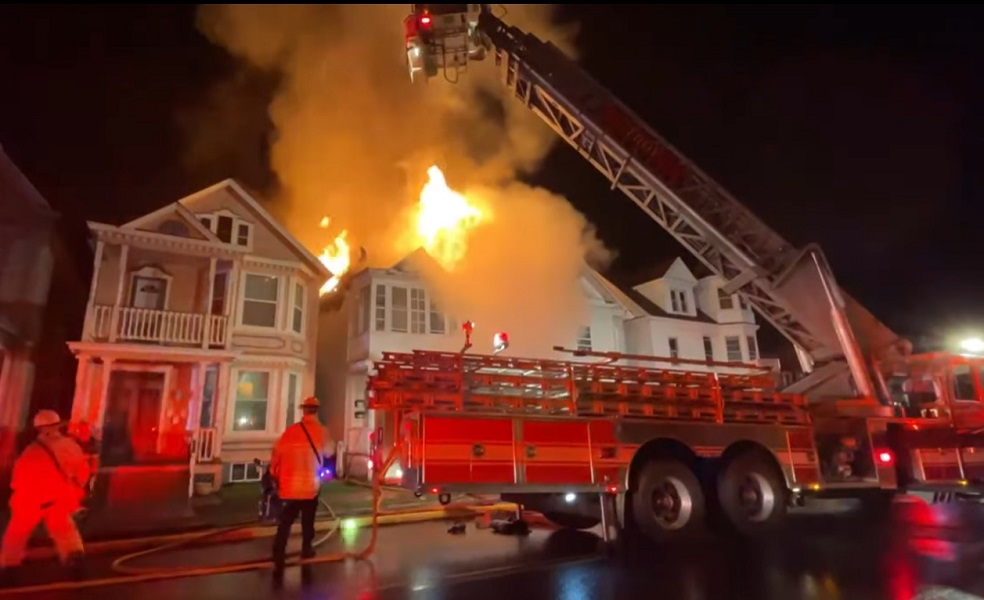 Troy firefighter battled a massive blaze that damaged multiple dwellings during a two-alarm fire.
