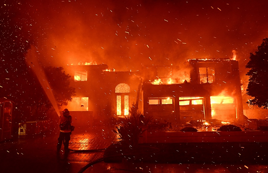 Firefighters battle a brush fire at Coronado Pointe in Laguna Niguel, California, on Wednesday, May 11, 2022.