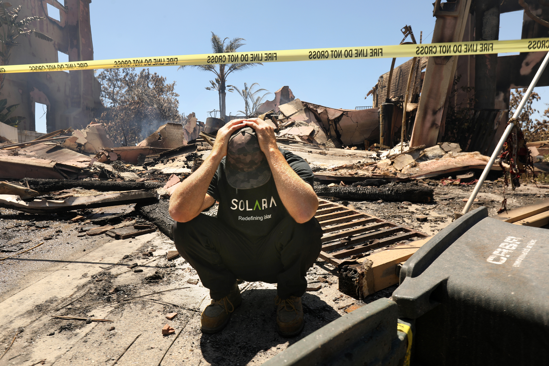 Matthew Vogel, 39, in front of his parents home, where he grew up in the Coronado Pointe neighborhood of Laguna Niguel, California, on Thursday, May 12, 2022. The home was completely destroyed the previous night, among at least 20 homes destroyed by fire, fueled by winds and drought.
