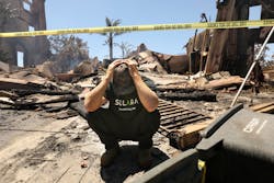 Matthew Vogel, 39, in front of his parents home, where he grew up in the Coronado Pointe neighborhood of Laguna Niguel, California, on Thursday, May 12, 2022. The home was completely destroyed the previous night, among at least 20 homes destroyed by fire, fueled by winds and drought. Matthew Vogel, 39, in front of his parents home, where he grew up in the Coronado Pointe neighborhood of Laguna Niguel, California, on Thursday, May 12, 2022. The home was completely destroyed the previous night, among at least 20 homes destroyed by fire, fueled by winds and drought.