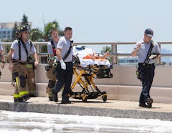 Firefighters work at the scene of a plane crash at the Haulover Inlet Bridge on Saturday, May 14, 2022, in Miami. Firefighters work at the scene of a plane crash at the Haulover Inlet Bridge on Saturday, May 14, 2022, in Miami.