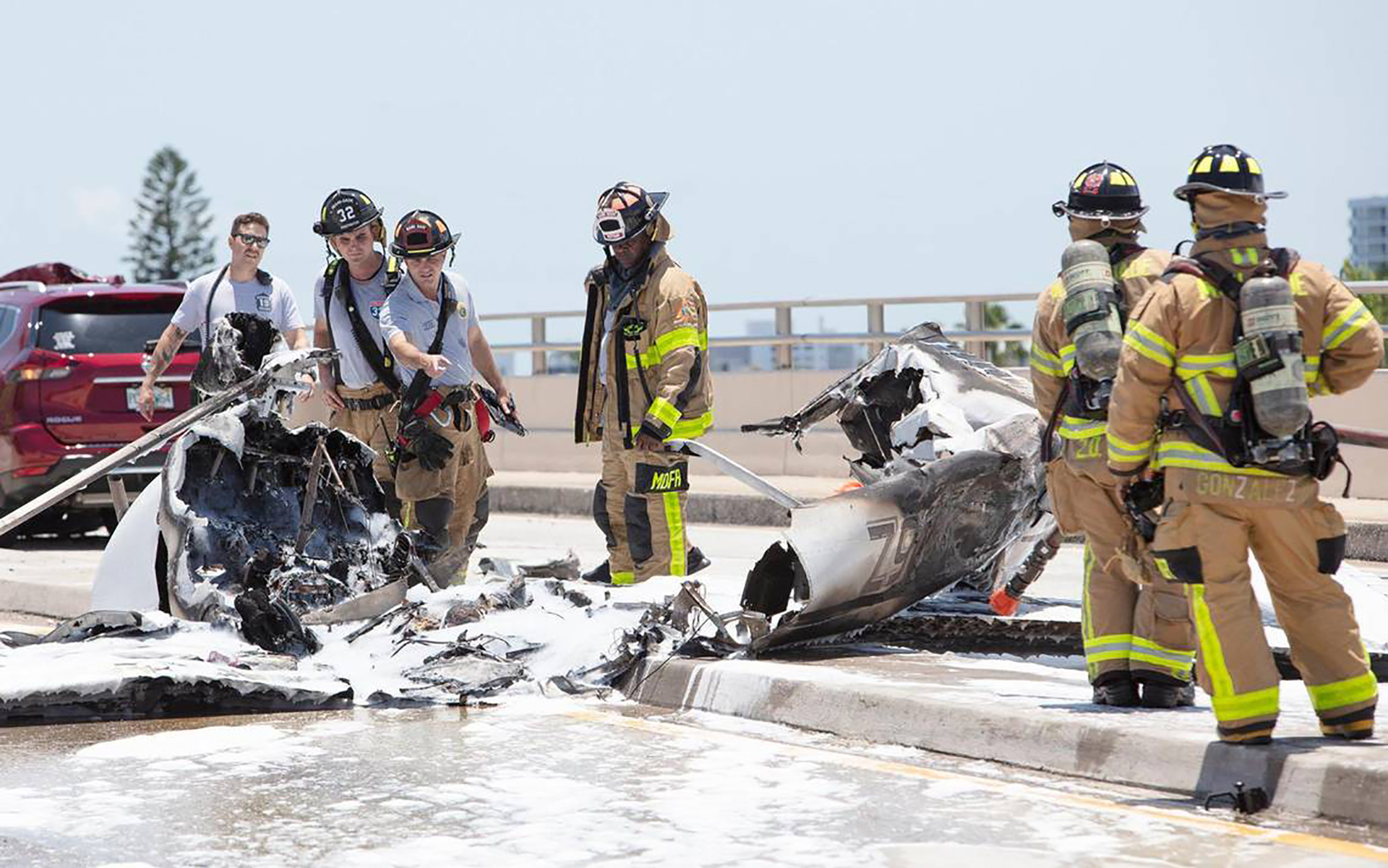 Miami-Dade rescue crews transport an injured patient after a plane hit the Haulover Inlet Bridge on Saturday, May 14, 2022, in Miami.