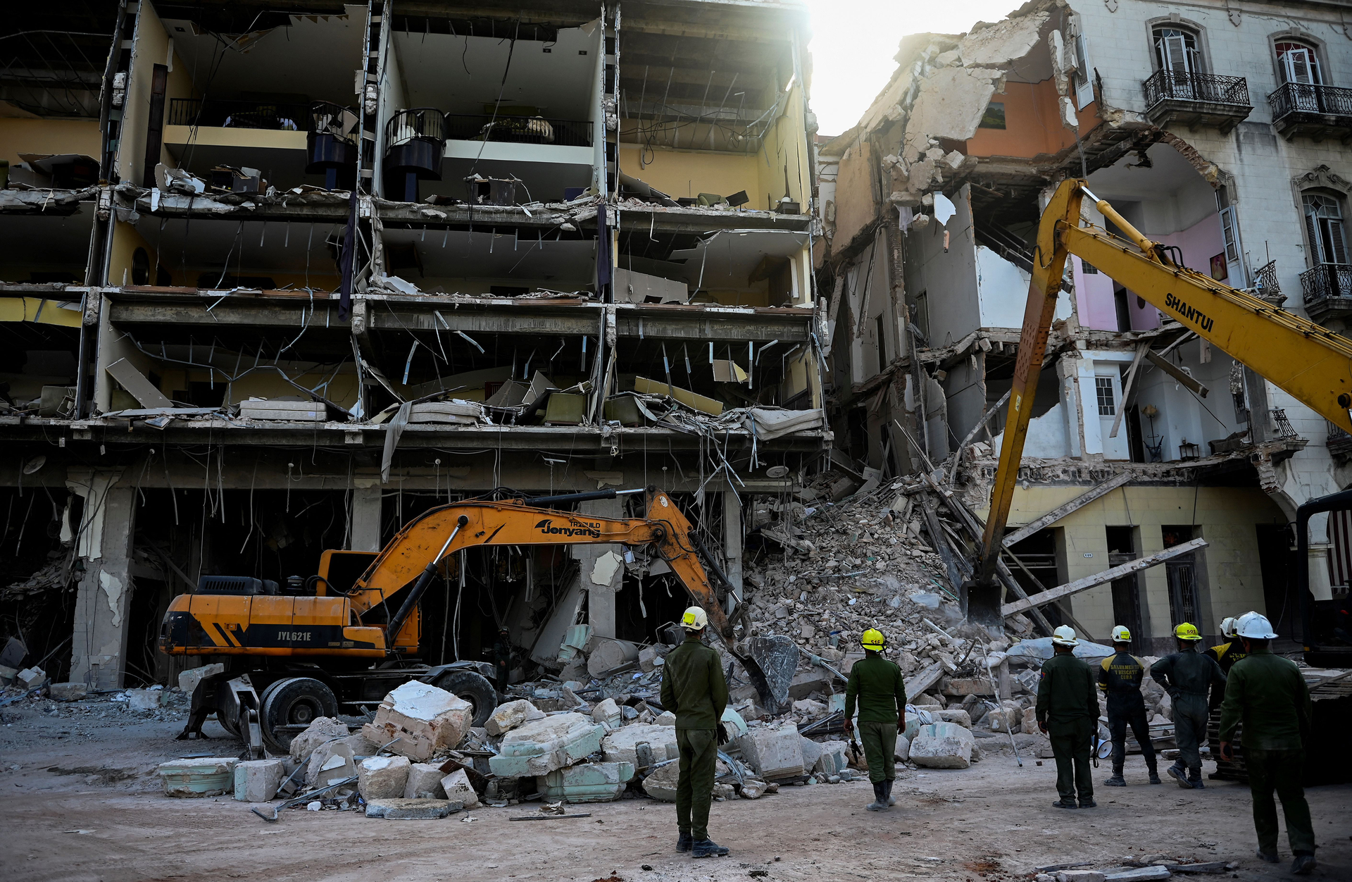 Rescuers remove debris from the ruins of the Saratoga Hotel, in Havana.
