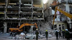 Rescuers remove debris from the ruins of the Saratoga Hotel, in Havana.