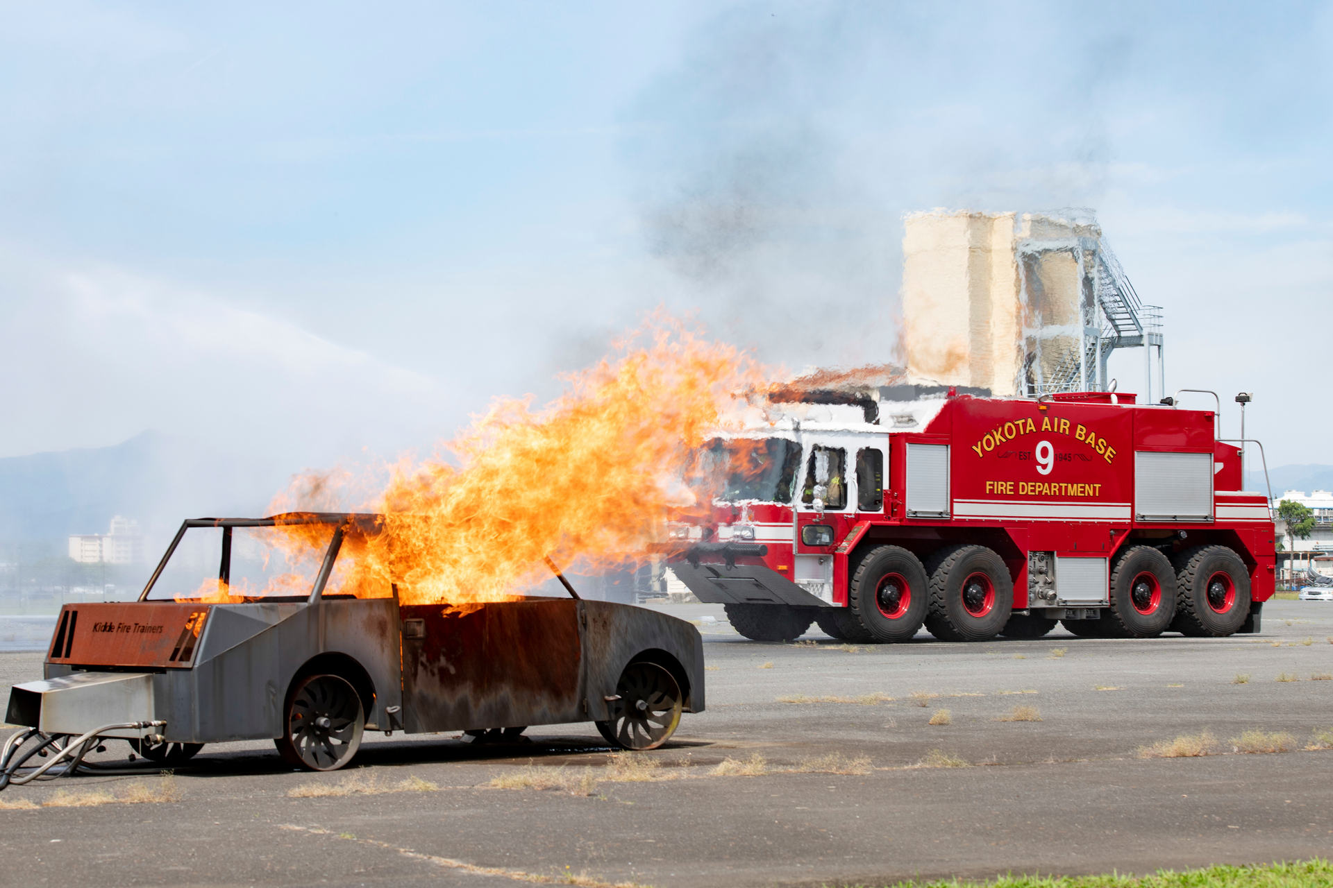 The 374th Civil Engineer Squadron Fire Department responds to a simulated aircraft incident during a major accident response exercise at Yokota Air Base in Japan.