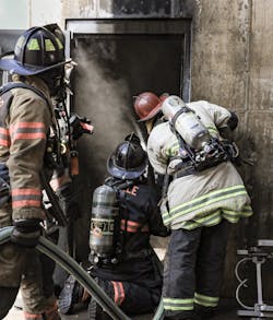 The hose crew of a minimally staffed department uses a thermal imaging camera at the entry door to flow water ahead toward the fire's room of origin. The hose crew of a minimally staffed department uses a thermal imaging camera at the entry door to flow water ahead toward the fire's room of origin.