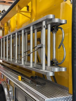 Unlike how many rural engine companies bed the 24-foot extension ladder first and the 14-foot roof ladder outside of that, a reverse configuration (shown) trims important seconds from the process of laddering the fire building. Unlike how many rural engine companies bed the 24-foot extension ladder first and the 14-foot roof ladder outside of that, a reverse configuration (shown) trims important seconds from the process of laddering the fire building.