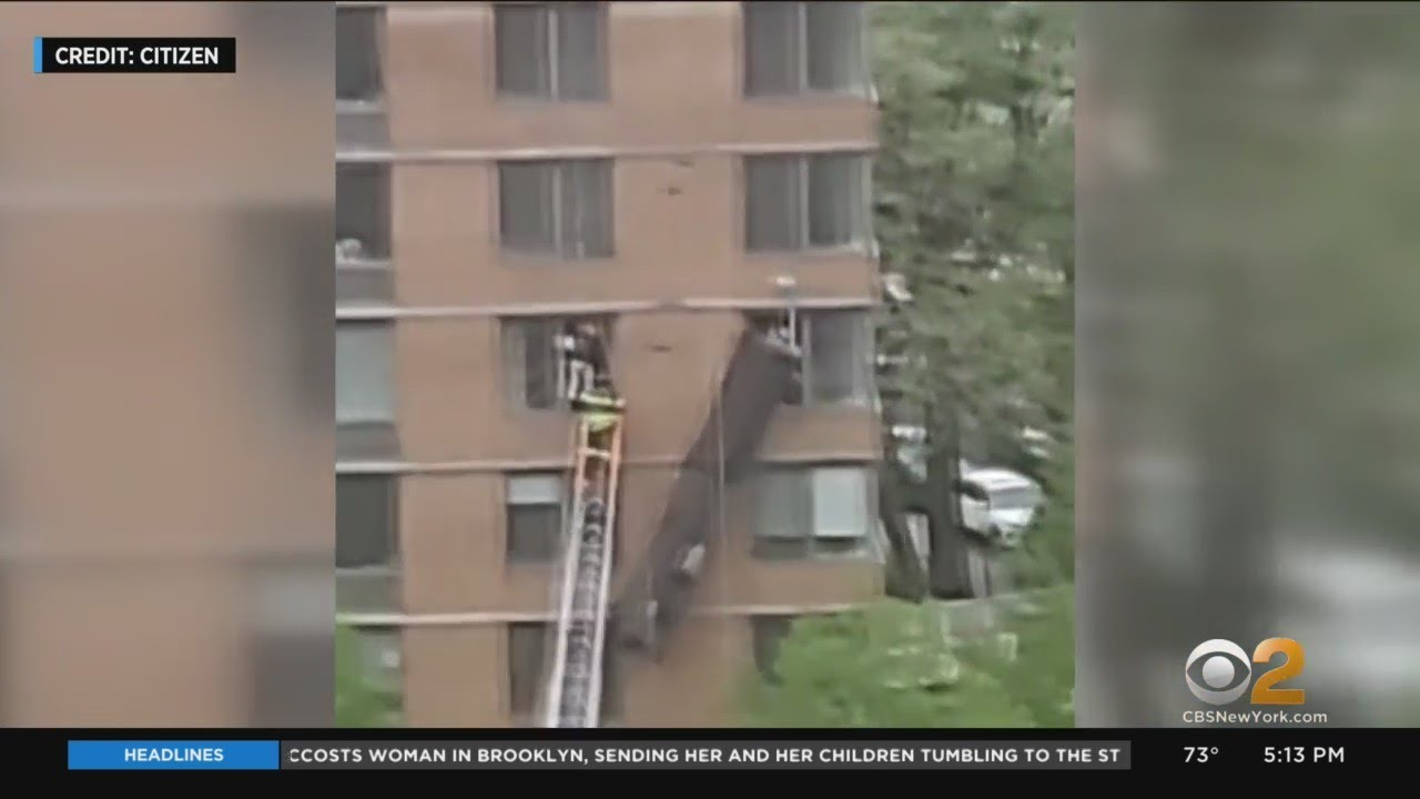 FDNY members perform a high-angle rescue of two dangling window washers.