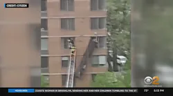 FDNY members perform a high-angle rescue of two dangling window washers.