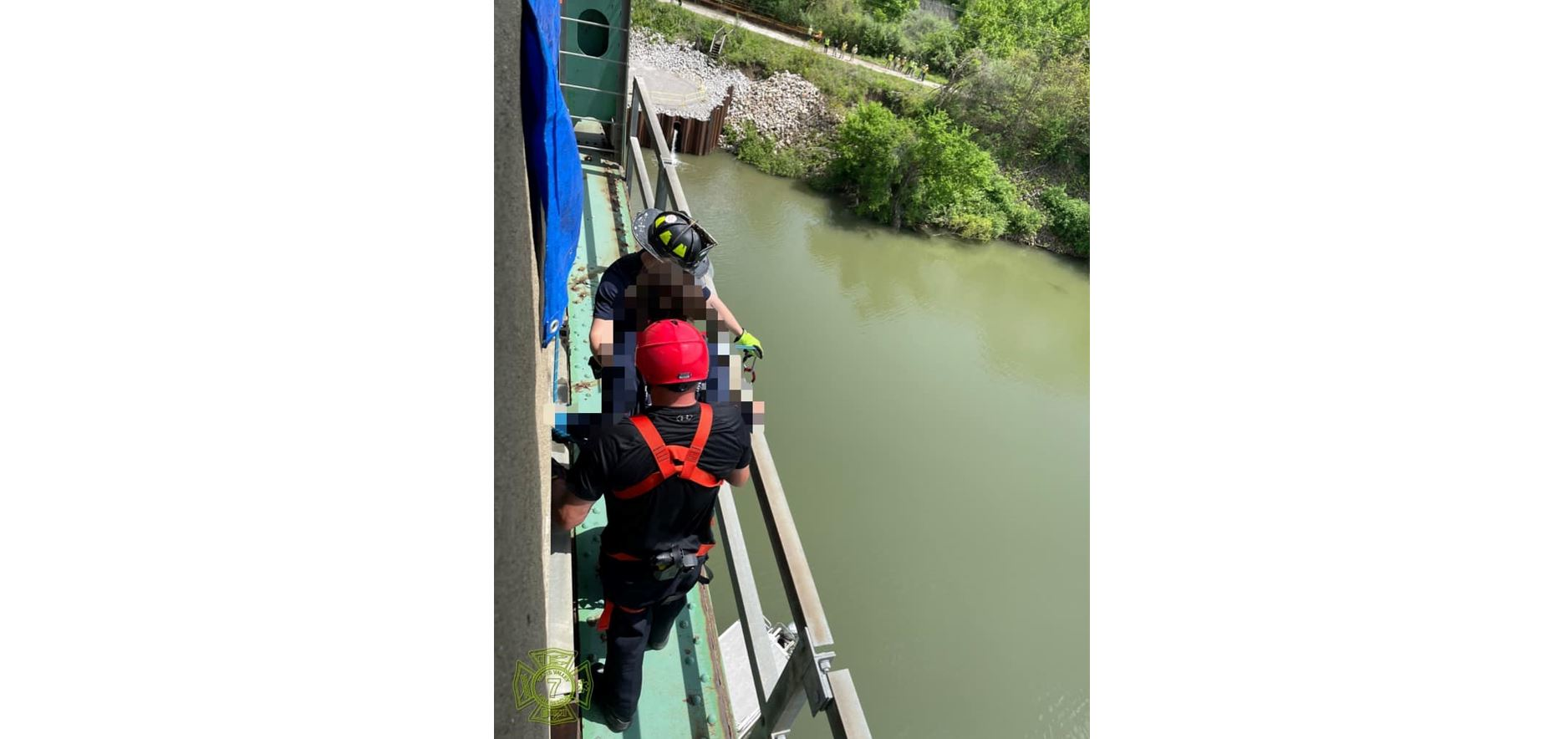 Multiple fire departments responded when an occupant of a vehicle crash accessed a bridge catwalk and refused to leave.