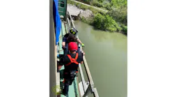 Multiple fire departments responded when an occupant of a vehicle crash accessed a bridge catwalk and refused to leave.