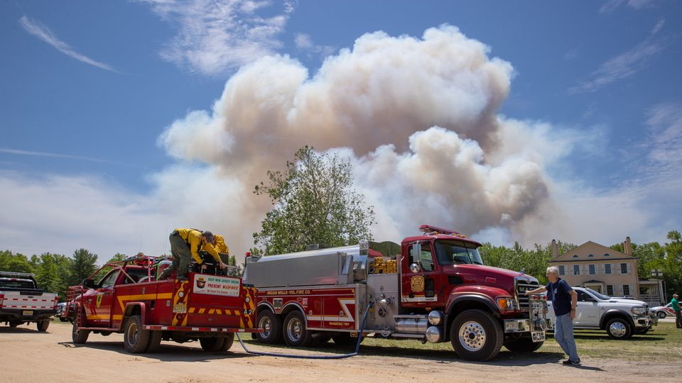 Smoke bellows from a fire burning in the Wharton State Forest, on Monday.