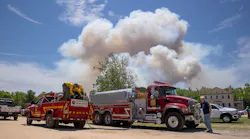 Smoke bellows from a fire burning in the Wharton State Forest, on Monday.