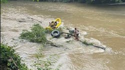 The four people — potentially teenagers or people in their 20s — were stranded on a log. The four people — potentially teenagers or people in their 20s — were stranded on a log.