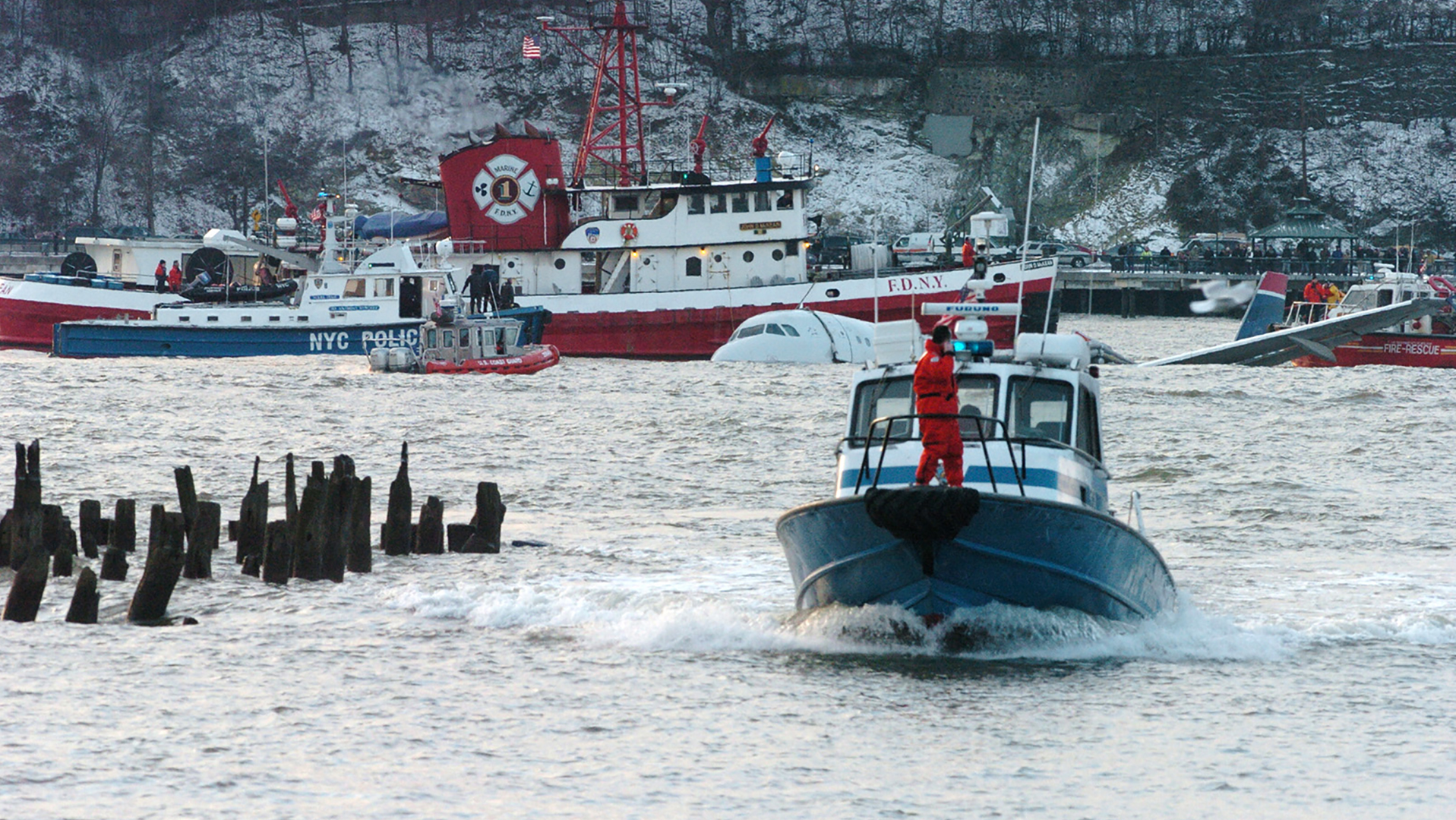 Fire and police boats operate after the plane crash landed in the Hudson River in 2009.