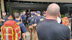 Police and other emergency crews gather at the Natalie Medical Building in Tulsa where four people were fatally shot.