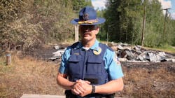 An Alaska State Trooper provides a media update last year after a series of fires destroyed a dozen structures last year. An Alaska State Trooper provides a media update last year after a series of fires destroyed a dozen structures last year.