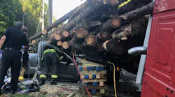 Marion County Vehicle Under Log Truck