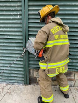 Locks that have exposed shackles (inset) are best cut when two members tackle the task. One member attaches a pair of locking pliers and a chain to the body of the lock, and the other cuts the shackle. Scoring the metal of the shackle at low rpm can help the process. Locks that have exposed shackles (inset) are best cut when two members tackle the task. One member attaches a pair of locking pliers and a chain to the body of the lock, and the other cuts the shackle. Scoring the metal of the shackle at low rpm can help the process.