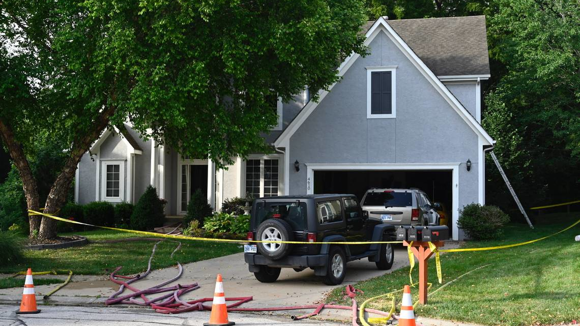 Four firefighters were injured Tuesday night when a stairwell collapsed at a house fire.