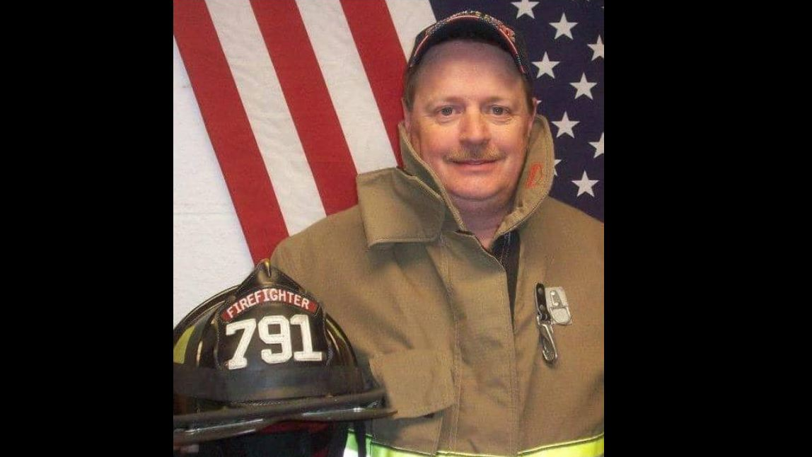 Almost two years after Adwolfe VFD firefighters Charles 'Dog' Woods died at a house, his family still owed $4,400 in funeral expenses.