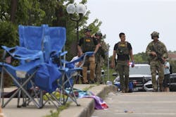 Law enforcement officers from multiple jurisdictions investigate the area in Highland Park on Monday, July 4, 2022. Law enforcement officers from multiple jurisdictions investigate the area in Highland Park on Monday, July 4, 2022.